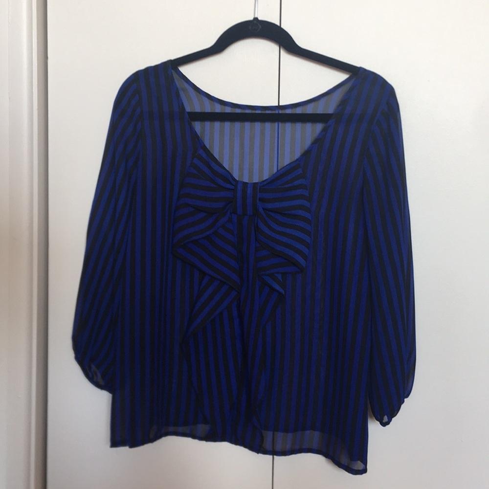 Adorable striped blouse with bow back detail!